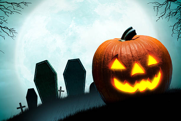 istock Jack O'lanterns In Front Of Cemetery 2226166891