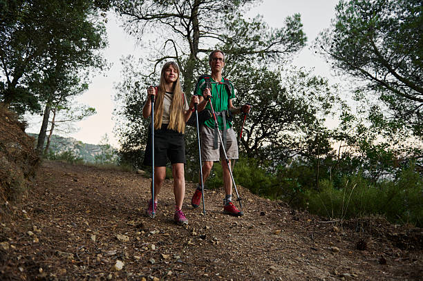 istock A Middle-Aged Couple Hiking on a Scenic Forest Trail Using Trekking Poles 2226168918