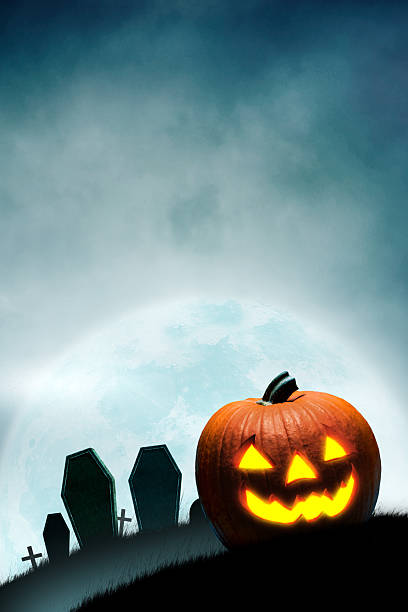 istock Jack O'lantern In Front Of Cemetery 2226170689