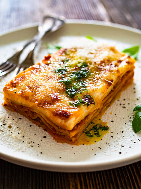 istock Lasagna with minced meat and bechamel sauce on wooden table 2226172740