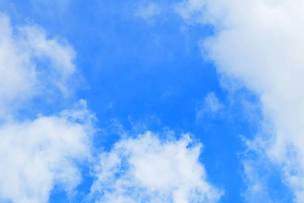istock Blue sky with white fluffy clouds in bright daylight captured for weather concept nature background texture and open atmosphere design with no objects or people 2226172814