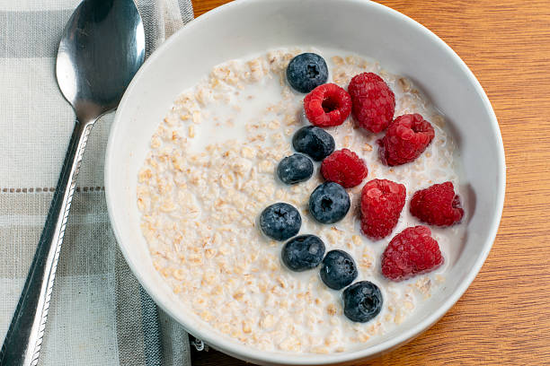 istock oatmeal top with blue berries and red raspberries 2226172961