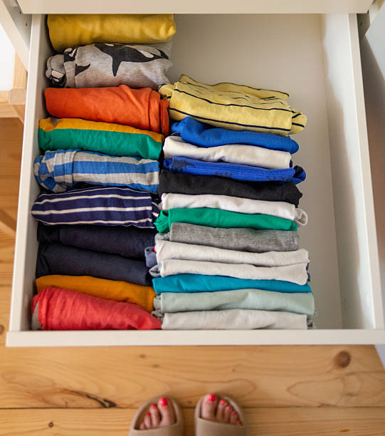 istock Colorful children's clothes neatly folded in a drawer 2226174446