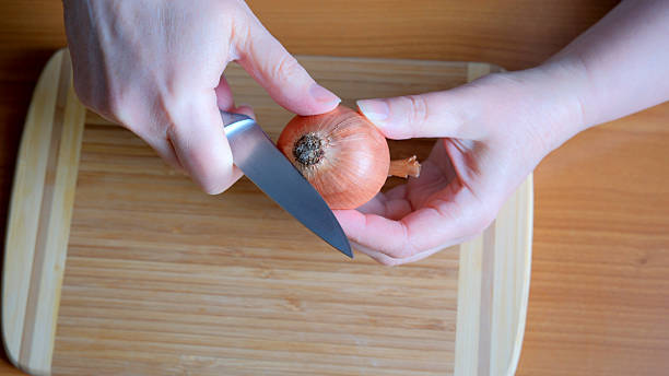 istock Chopping onions with precision in a cozy kitchen 2226175110