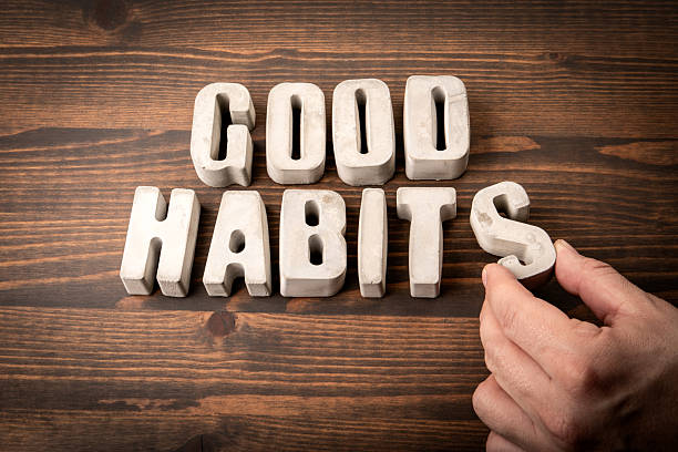 istock GOOD HABITS. Concrete alphabet letters on a wooden texture background 2226177738