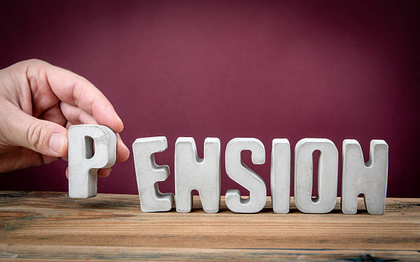 istock PENSION Word Created from Concrete Alphabet Letters on Wooden Des 2226177743