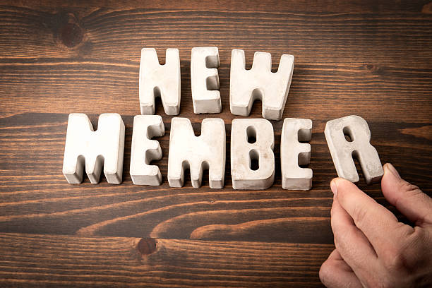 istock NEW MEMBER. Concrete alphabet letters on a wooden texture background 2226177763
