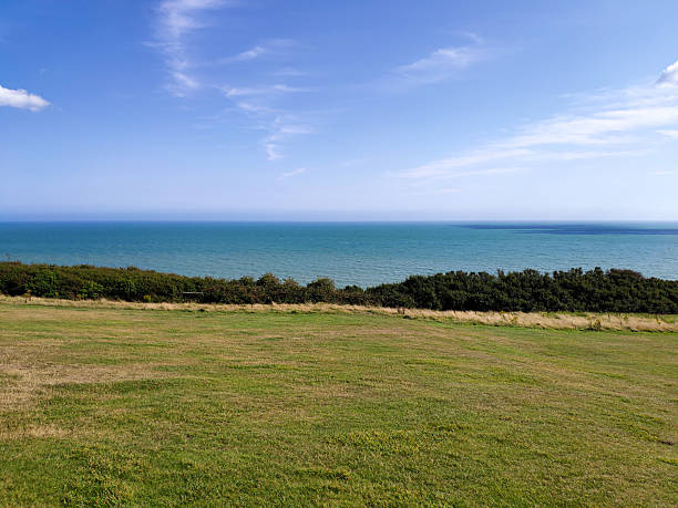 Scenic coastal landscape around Hastings, East Sussex, UK. Photos capture grassy walking trails, and panoramic views over the English Channel. The area includes parts of Hastings Country Park and is popular for coastal hikes, birdwatching, and nature photography. Ideal for themes like British coastline, nature, travel, and outdoor adventure.