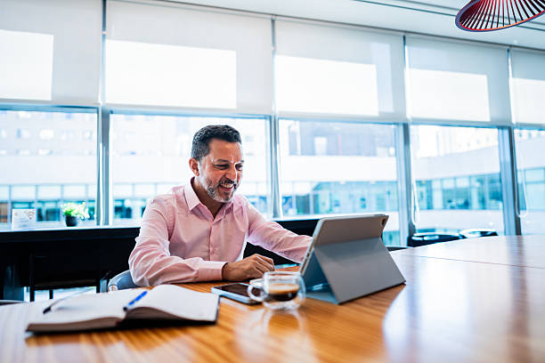 istock Mature businessman using digital tablet working at office 2226179148