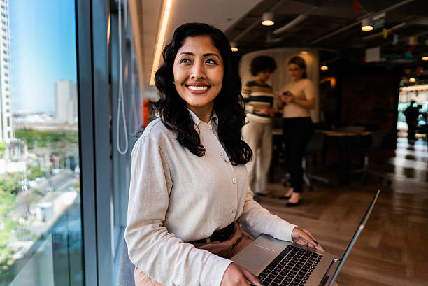 istock Young businesswoman contemplating while using laptop at office 2226179264