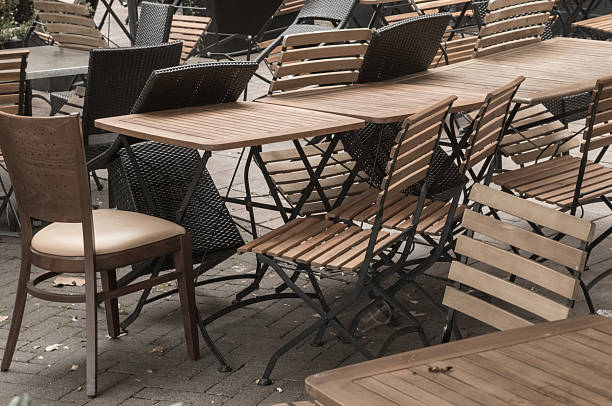 istock Empty outdoor cafe tables and chairs inviting customers 2226179755