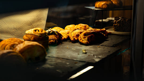 Delicious pastries and croissants displayed in bakery window