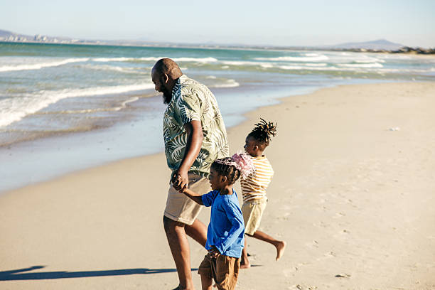 istock Quality Time: Dad Leads the Fun on the Shore 2226190101