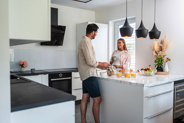 istock Caucasian Couple Preparing Breakfast in a Modern Kitchen with Natural Light 2226194540