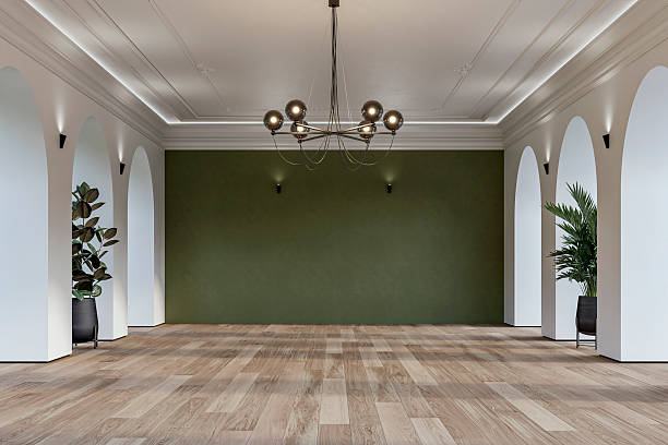 istock Modern empty interior with elegant arched openings, decorative ceiling molding, chandelier and decorative potted plants 2226194740