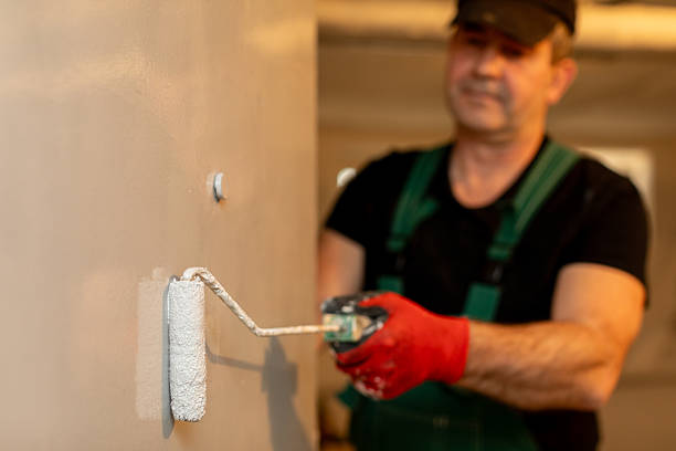 istock A Skilled Professional Painter Is Currently at Work Applying a Fresh Coat of Paint to Surfaces 2226196364