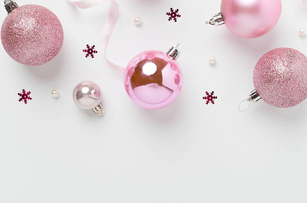 istock Pink christmas balls with decor on color background, top view 2226199805