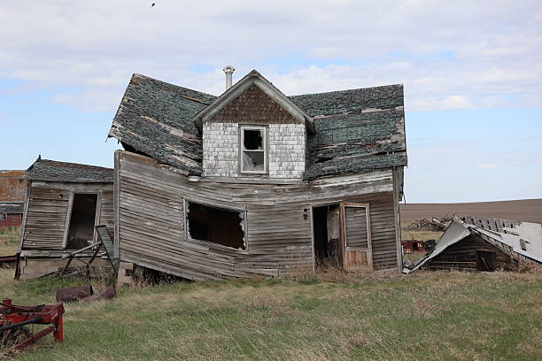 The old house is slanted and falling over because of it has been abandoned and neglected. The prairie history attached to the old building will forever be lost.