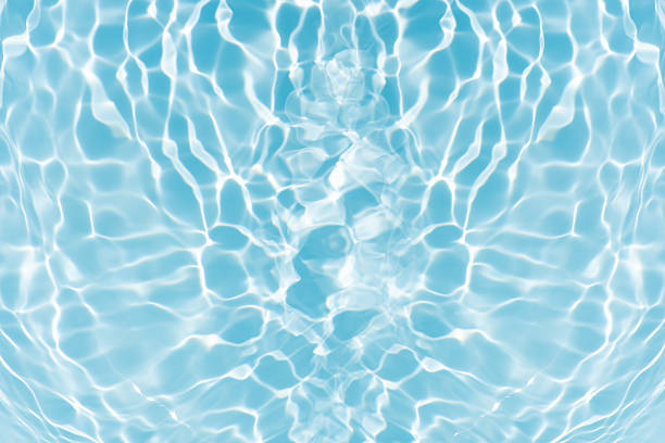 istock Blue water with ripples on the surface. Defocus blurred transparent blue colored clear calm water surface texture with splashes and bubbles. Water waves with shining pattern texture background. 2226201388