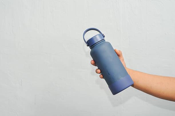istock holding a drinking water tumbler 2226205860