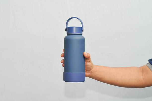 istock holding a drinking water tumbler 2226205862