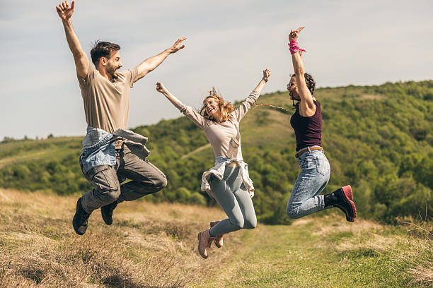 istock Happy Friends Jumping In Nature 2226205877
