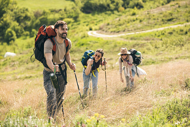 istock Friends Hiking With Hiking Poles 2226205952