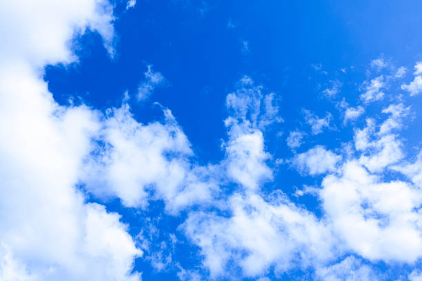 istock Clear blue sky with white fluffy clouds on a sunny day 2226213009
