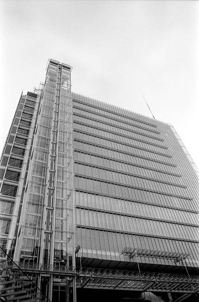 istock Modern office building with external glass elevator in monochrome 2226213519