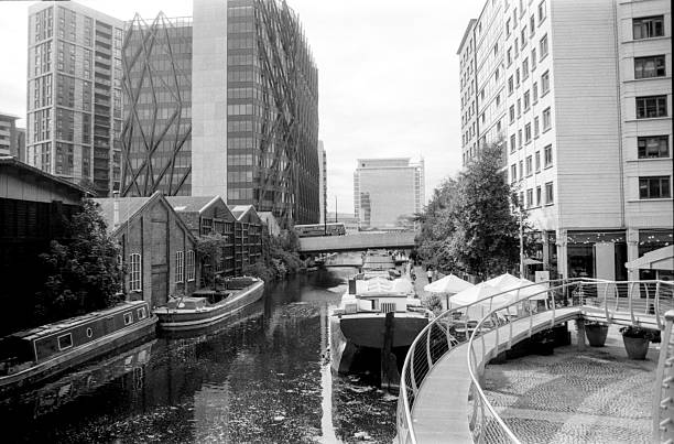 istock Birmingham canal boats reflecting modern architecture in monochrome 2226213529