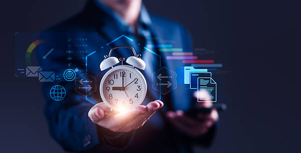 istock Businessman Holding Alarm Clock for Effective Project Time Management 2226214017