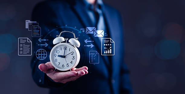 istock Professional Man Holding Alarm Clock Surrounded by Time Management Icons 2226214049
