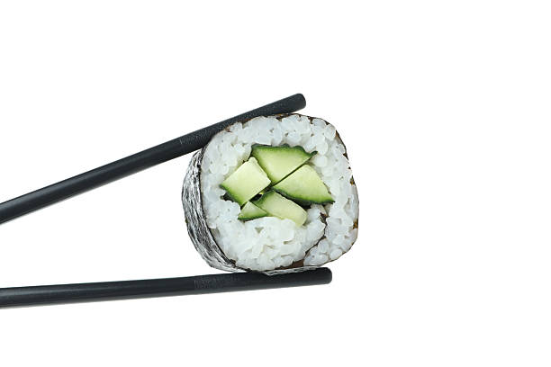 istock Chopsticks with maki isolated on white background 2226216736