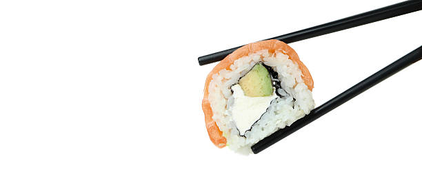 istock Chopsticks with roll isolated on white background 2226216827