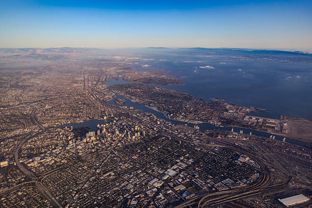 An aerial view of East Bay area, Oakland and Alameda, from a Southwest flight (not in picture) just departed from Oakland International Airport (OAK) during sunset hour.  HDR encoded