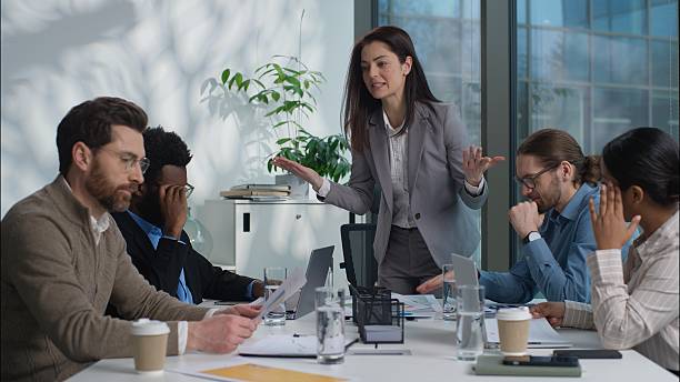 istock Caucasian woman leader arguing shout stress financial problem trouble documents bad work result boss angry talk dissatisfied team in office businesspeople business diversity multinational women men 2226223043