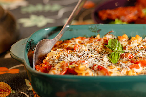 istock Delicious Tomato and Cheese Baked Rice with Fresh Basil Garnish 2226223314