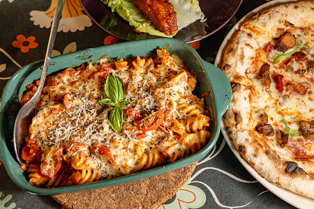 istock Delicious Italian Pasta and Pizza Served on a Cozy Table 2226223341