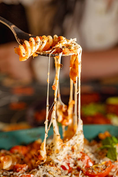 istock Delicious Italian Pasta with Stretchy Cheese and Fresh Ingredients 2226223383