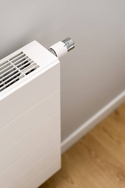 istock Modern electric heater for efficient home heating in a cozy living space 2226225085