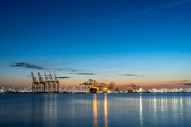 Port in USA in full activity during the sunset showing calm waters and a beautiful sky