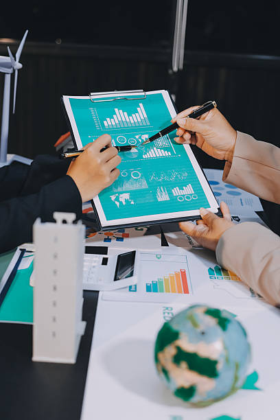 istock Carbon offset price report CO2 emission. Future growth Net zero waste in ESG ethical SME office protect climate change global warming social issues project. Group of asia people Eco friendly SDGs plan 2226230292