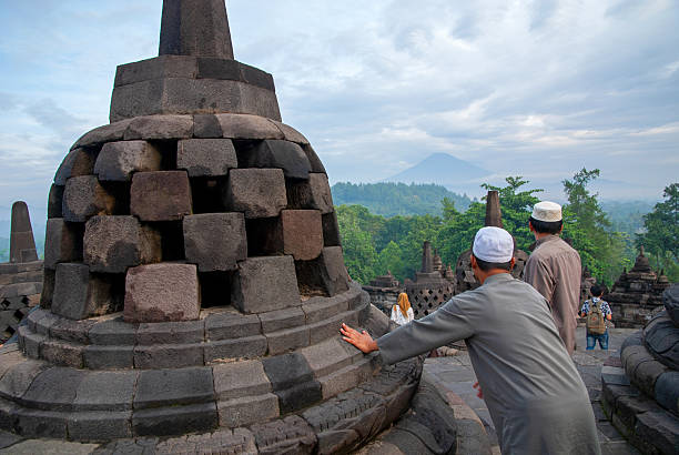 Visitors explore the majestic Borobudur Temple, located in Magelang, Central Java, Indonesia. Recognized as the world's largest Buddhist temple and a UNESCO World Heritage Site, Borobudur dates back to the 9th century and is renowned for its intricate stone carvings and stupas. Since the COVID-19 pandemic, access to the upper levels of the temple, where the main stupas are located, has been restricted by the Indonesian government to help preserve the structure and manage crowd control. Despite the limitations, Borobudur remains one of Indonesia’s most iconic cultural and spiritual destinations, attracting both local and international tourists.
