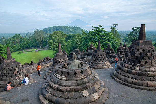 Visitors explore the majestic Borobudur Temple, located in Magelang, Central Java, Indonesia. Recognized as the world's largest Buddhist temple and a UNESCO World Heritage Site, Borobudur dates back to the 9th century and is renowned for its intricate stone carvings and stupas. Since the COVID-19 pandemic, access to the upper levels of the temple, where the main stupas are located, has been restricted by the Indonesian government to help preserve the structure and manage crowd control. Despite the limitations, Borobudur remains one of Indonesia’s most iconic cultural and spiritual destinations, attracting both local and international tourists.