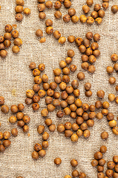 fried but not boiled chickpeas are on the table with a tablecloth
