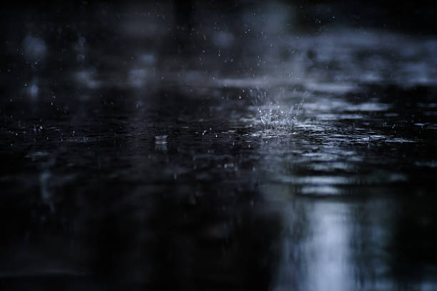istock heavy raining make many small splash crown from water droplets drop down to the concrete floor in blue tone color scene 2226241420