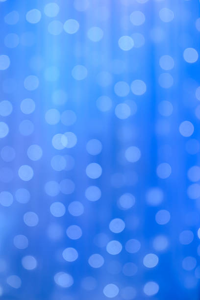 blurred focus of decorative lights in blue background