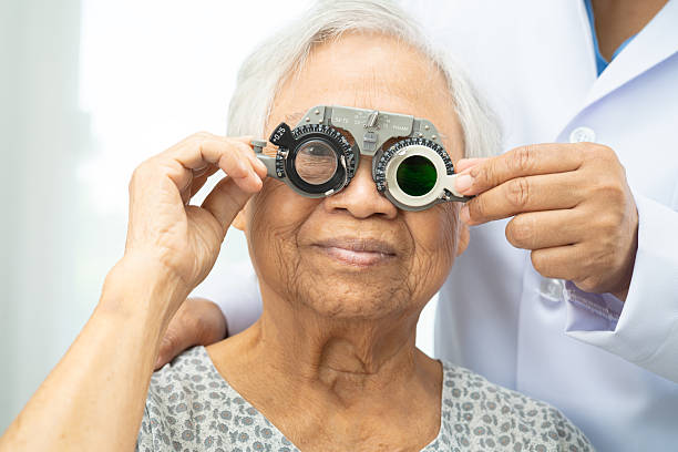 istock Asian senior woman wearing ophthalmic vision eye test and using optical trial frame. 2226244596