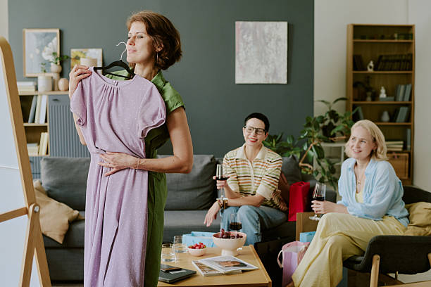 istock Middle Aged Caucasian Woman Choosing Dress 2226245521