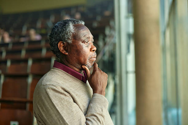 istock Thoughtful black professor by the window in lecture hall. 2226245795